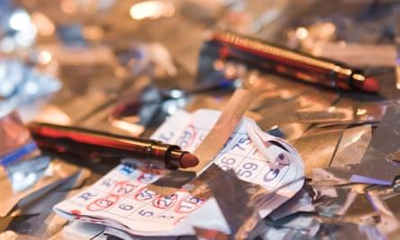 Close up image of bingo marker pens and discarded bingo cards, promoting Rebel Bingo club night.