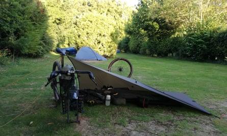 A tarp shelter on a campsite field