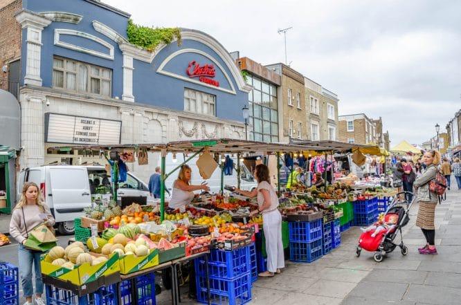 People shopping down the famous Portobello Road, one of the most famous weekend markets in London